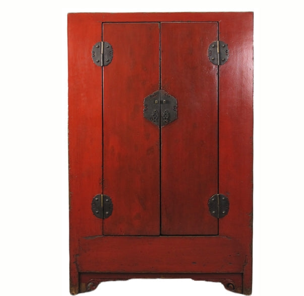 Red wooden cabinet with metal handles on a white background