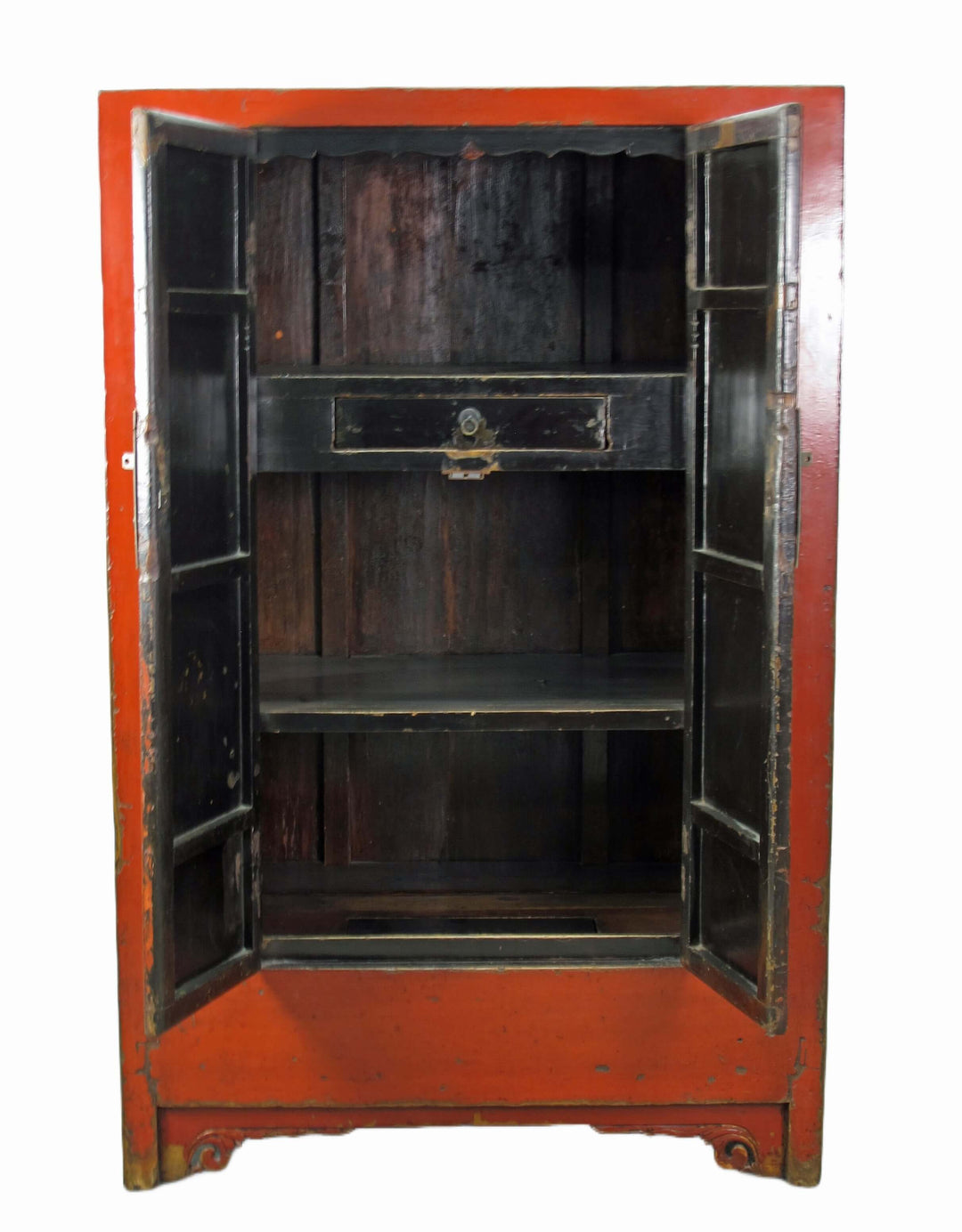 Vintage wooden cabinet with red exterior and black interior on a white background