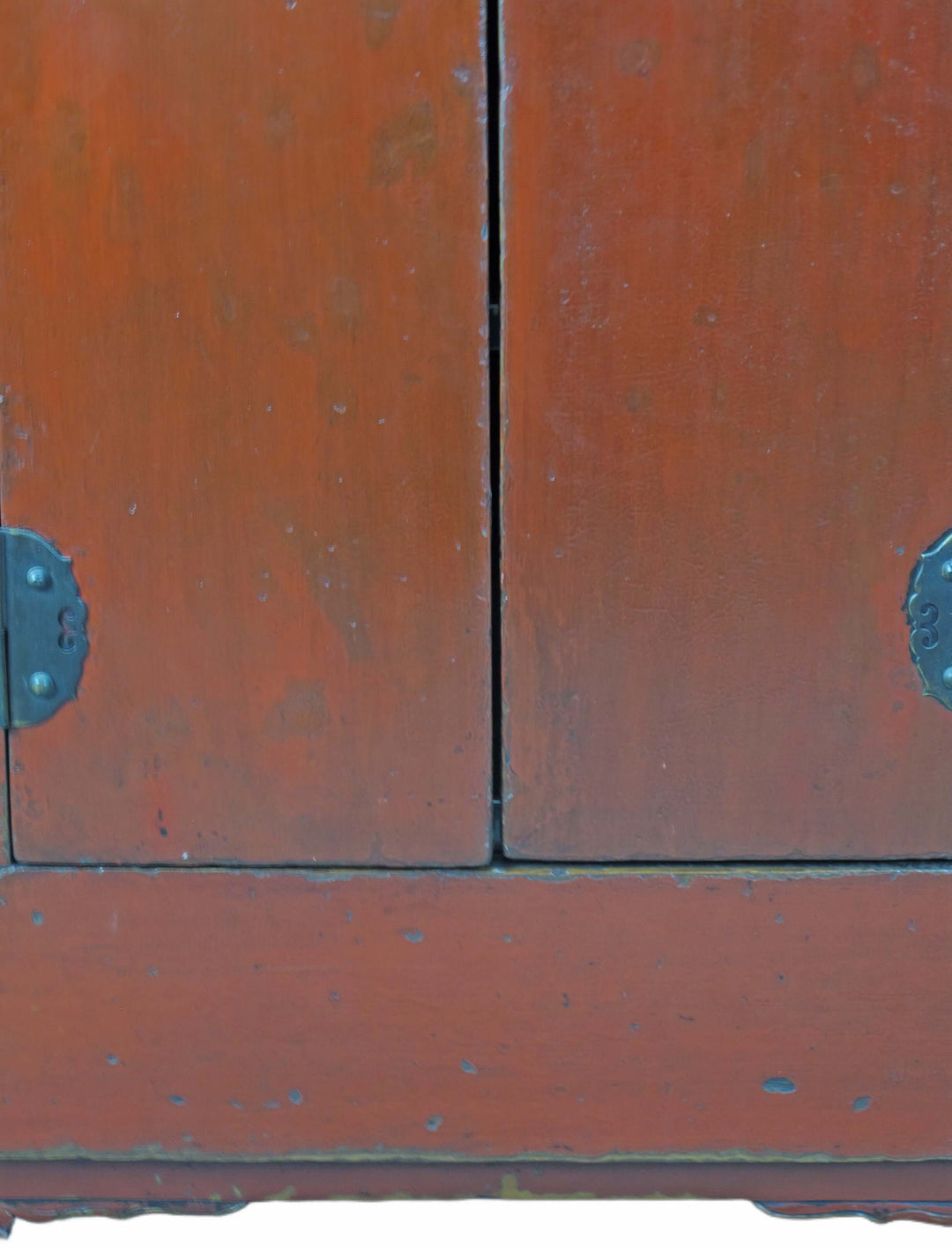 Close-up of a wooden cabinet with metal handles