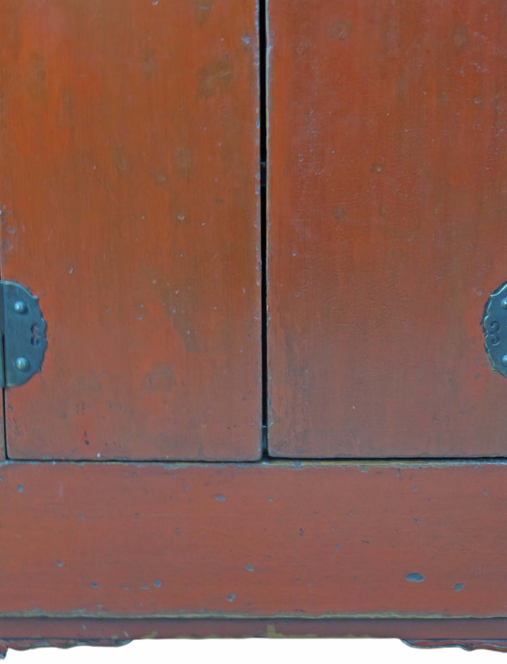 Close-up of a wooden cabinet with metal handles