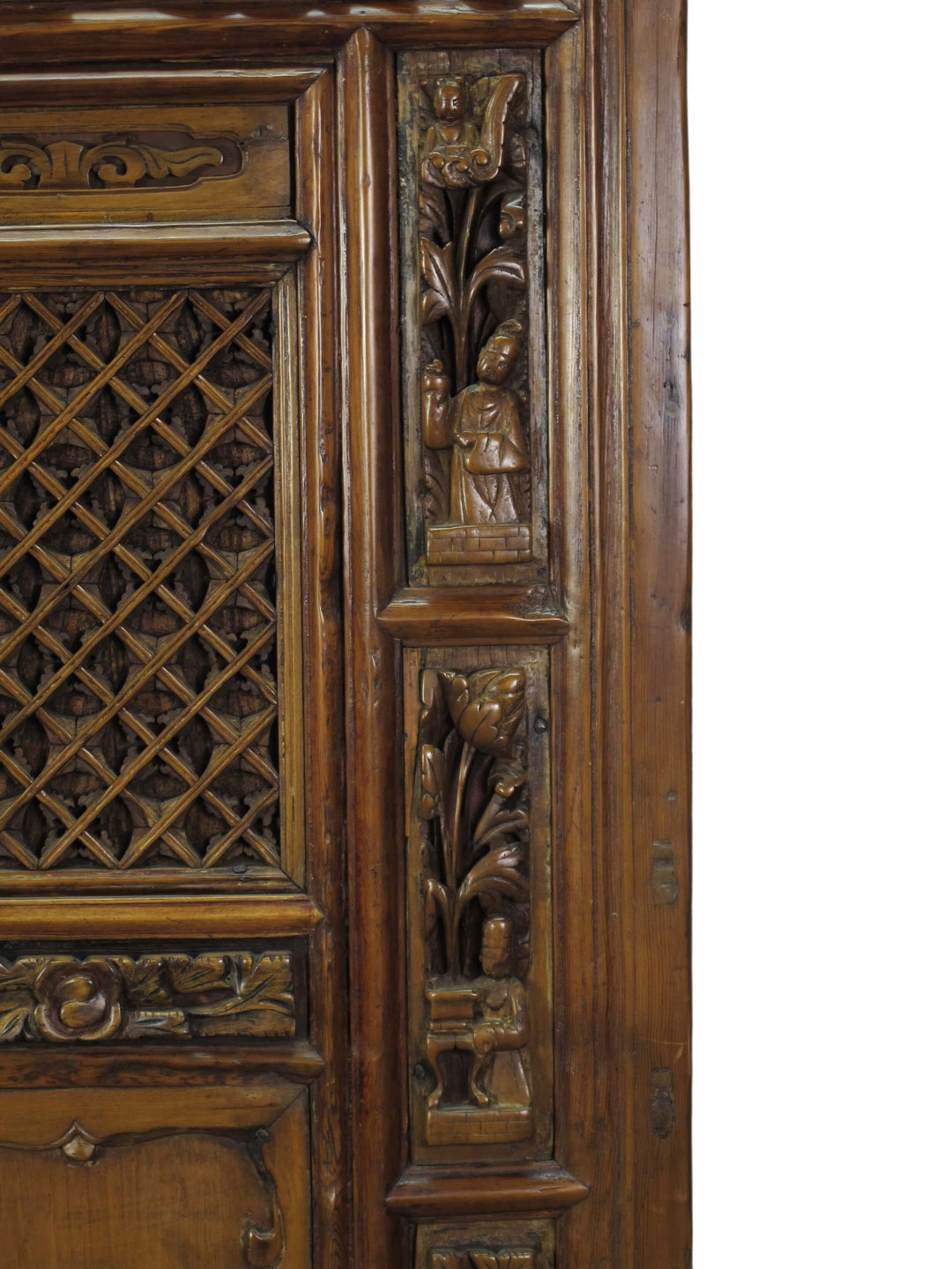 Carved wooden panel with intricate patterns on a white background