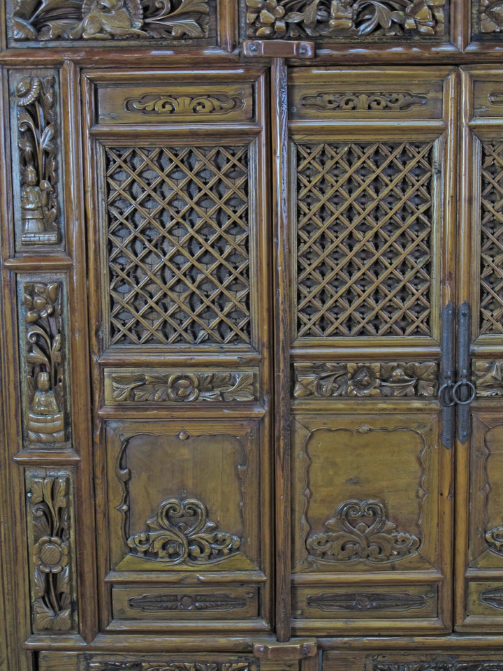 Close-up of intricately carved wooden panel with lattice patterns
