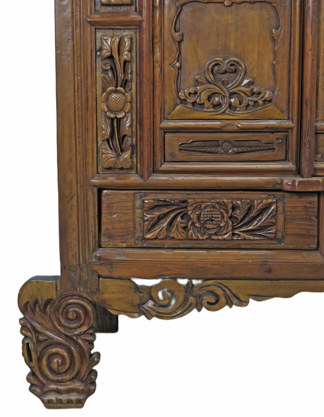 Close-up of an intricately carved wooden piece with detailed patterns on a white background