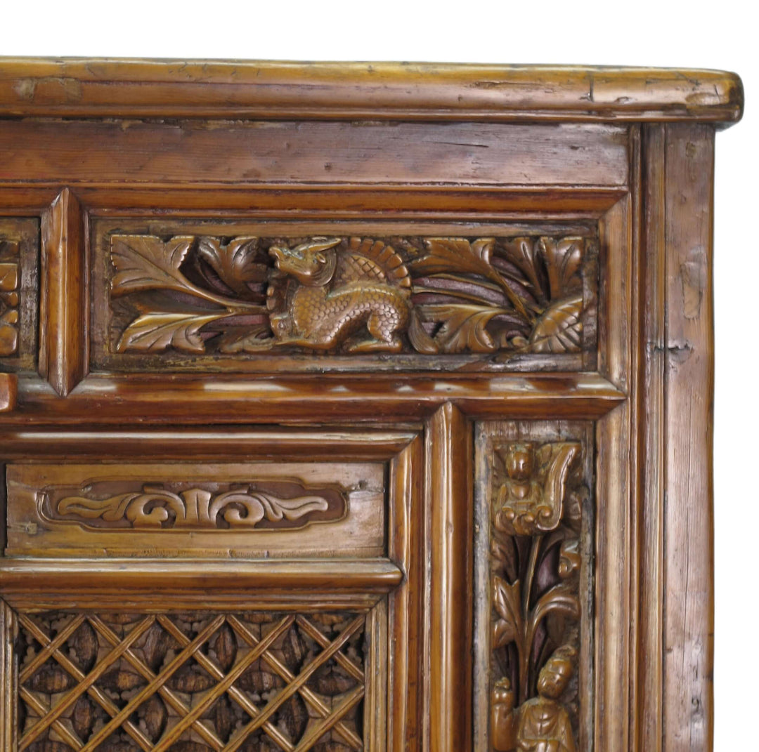 Close-up of a wooden panel with intricate carvings