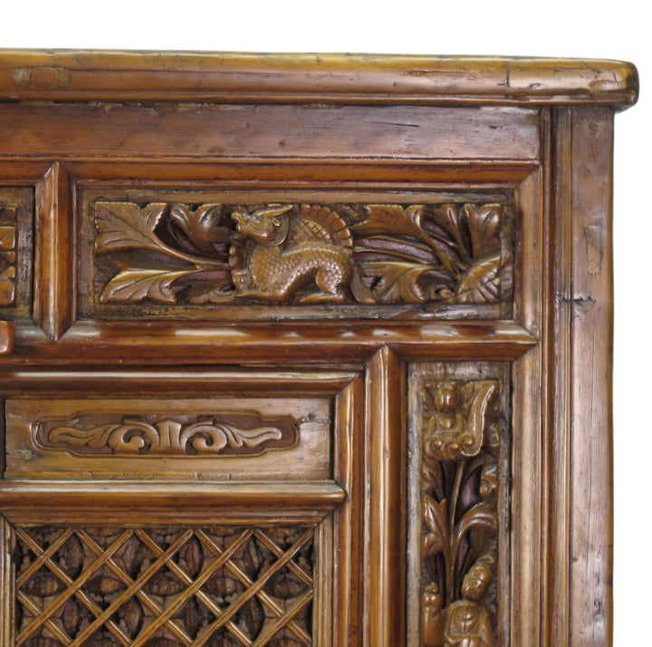 Close-up of a wooden panel with intricate carvings