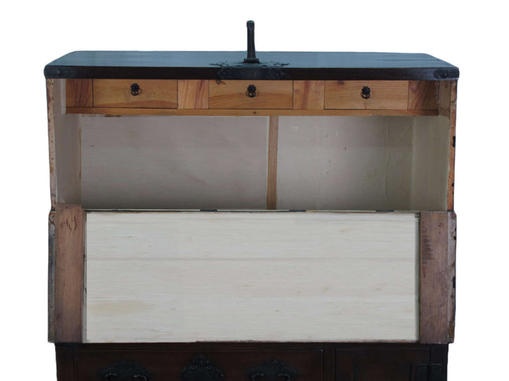 Wooden cabinet with a metallic top on a white background