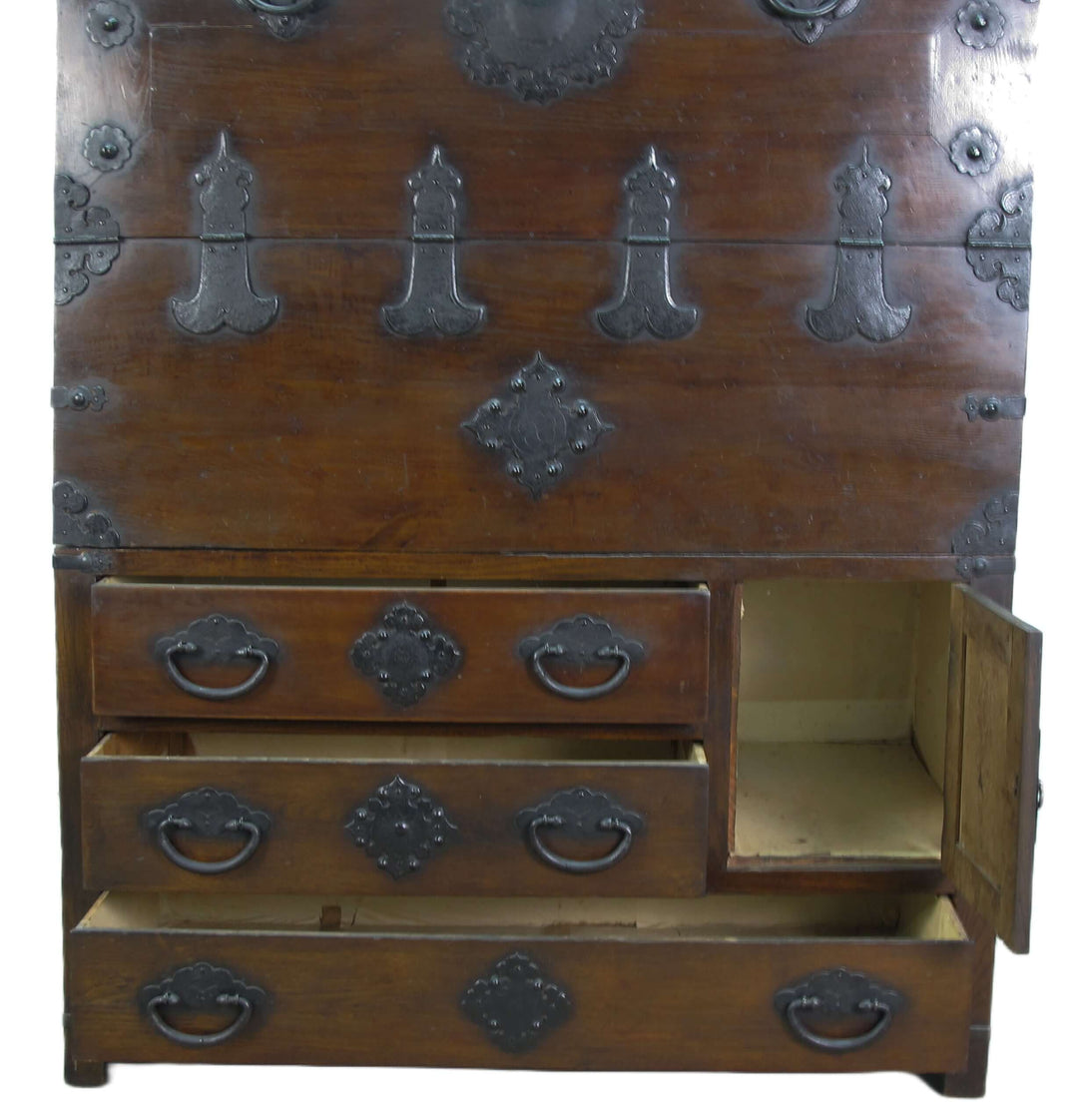 Wooden chest with metal embellishments on a white background