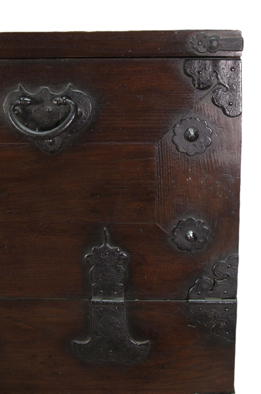 Close-up of a wooden chest with metal hardware