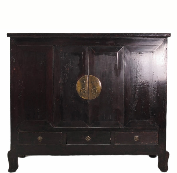 Dark wooden cabinet with brass handle on a white background