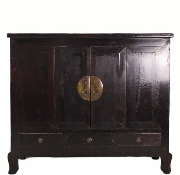 Dark wooden cabinet with brass handle on a white background