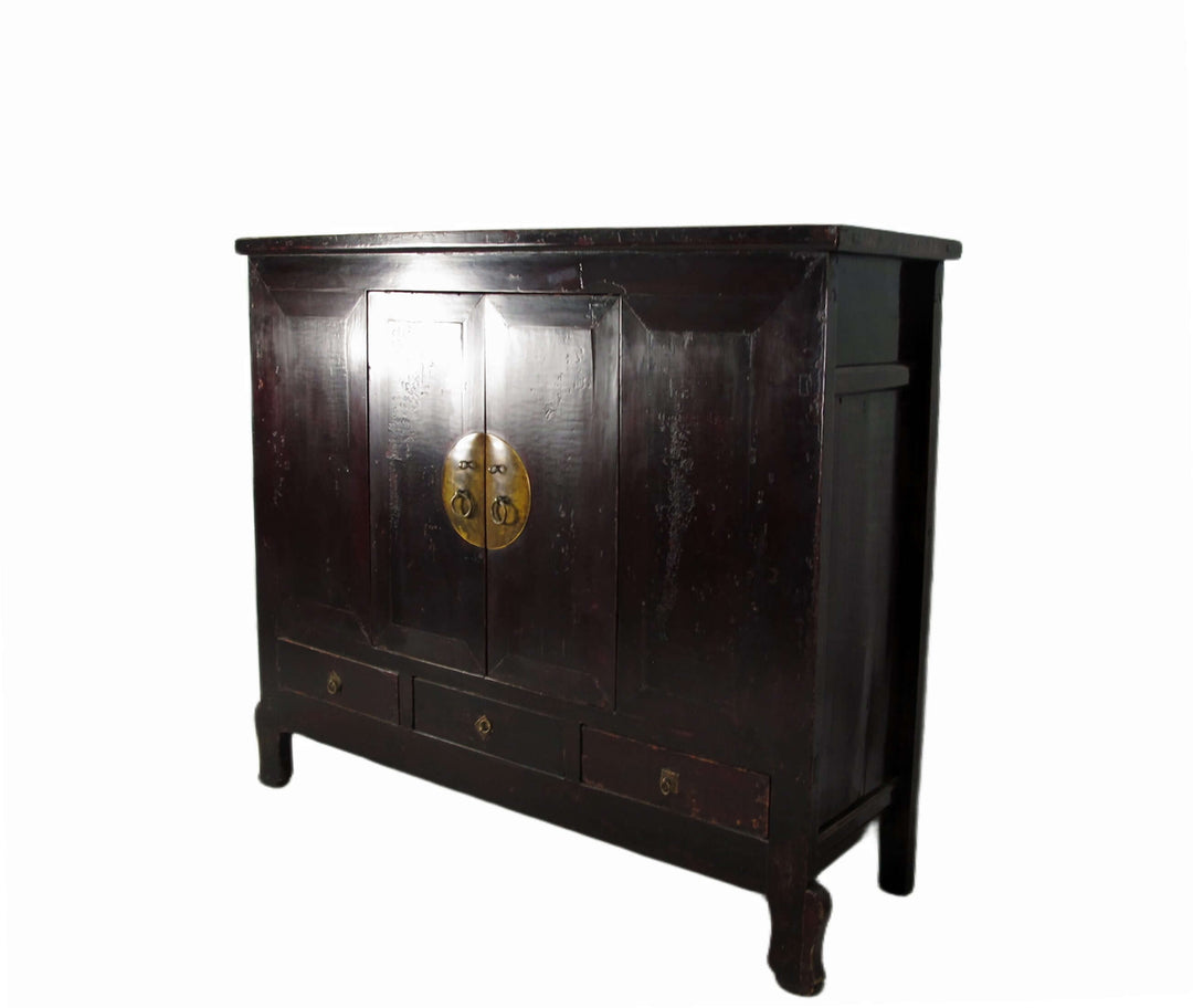 Dark wooden cabinet with gold emblem on a white background
