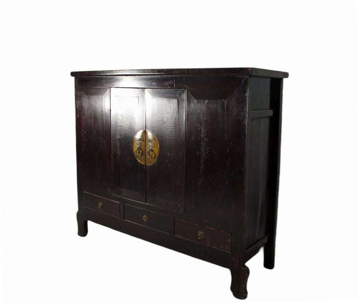 Dark wooden cabinet with gold emblem on a white background