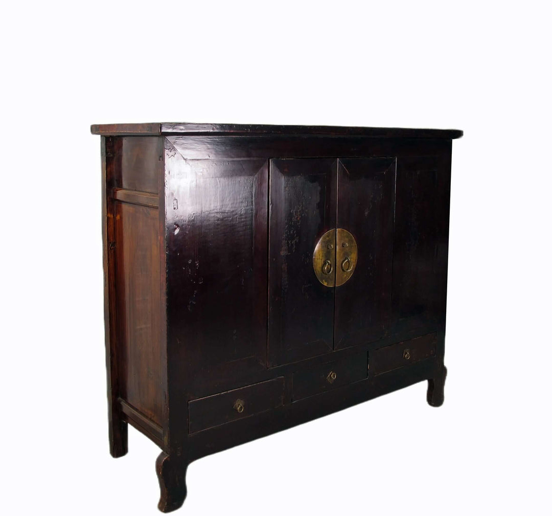Dark wooden cabinet with brass handle on a white background