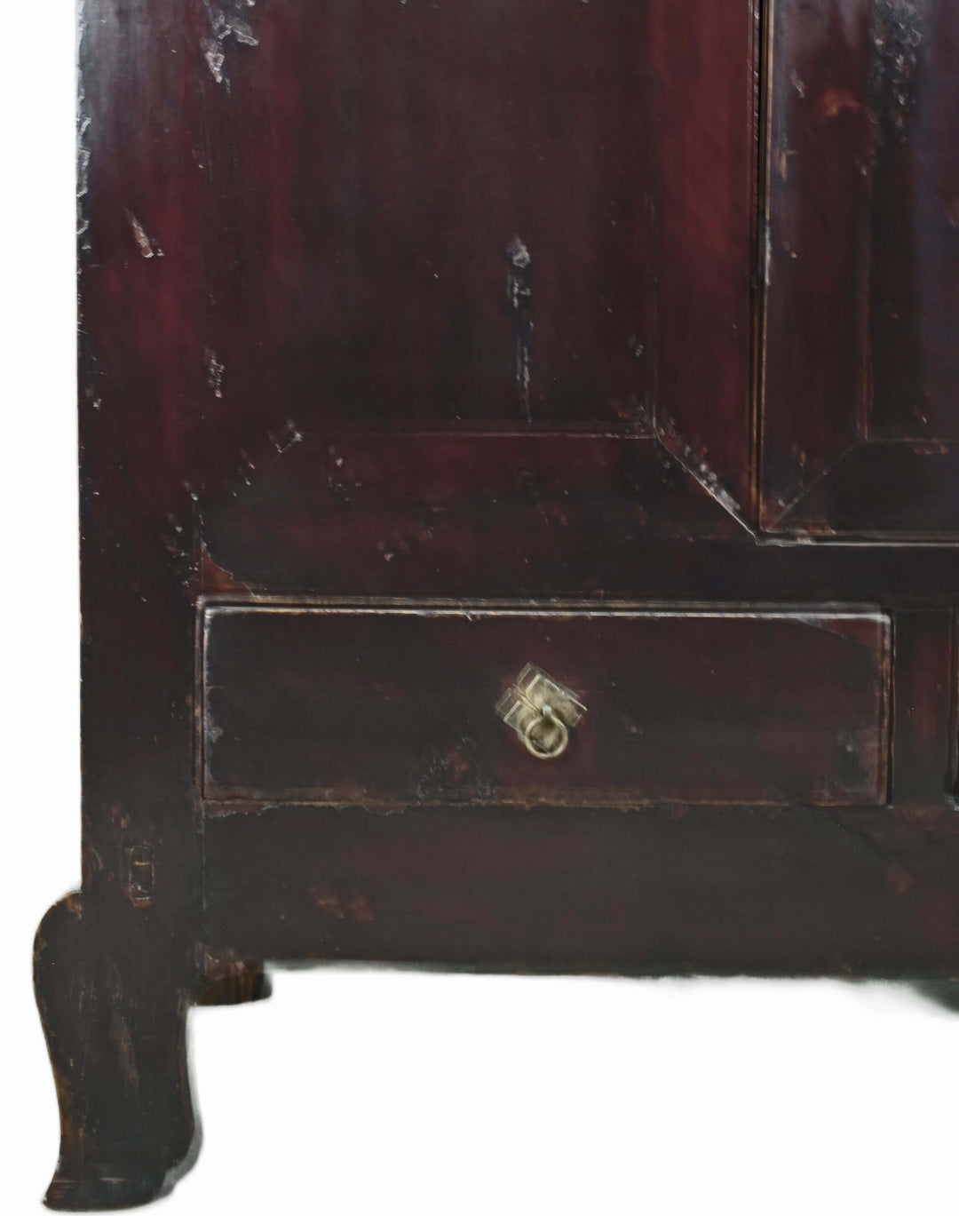 Close-up of a dark wooden cabinet with a visible lock on a white background