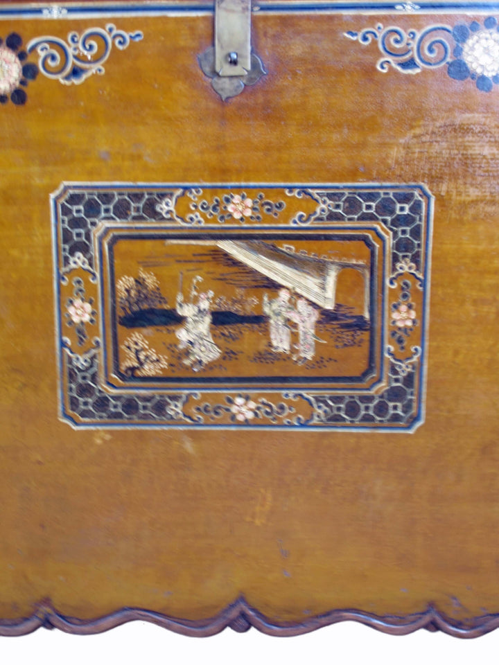Decorative wooden box with intricate inlay work featuring people and musical instruments.