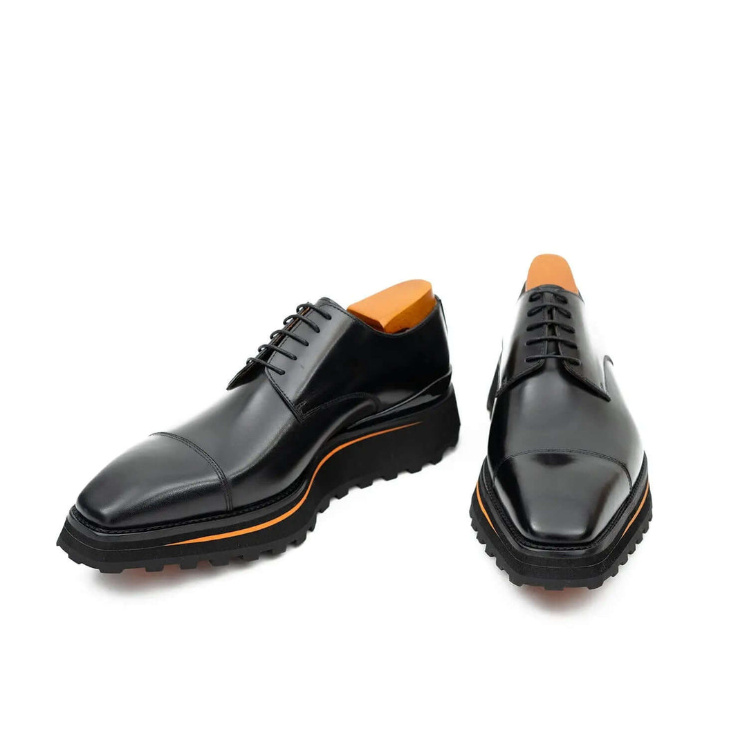 Calf leather dress three quarters derby shoes Black by DV DIVINCH with orange detail and lug sole. Side view of handcrafted leather shoes.
