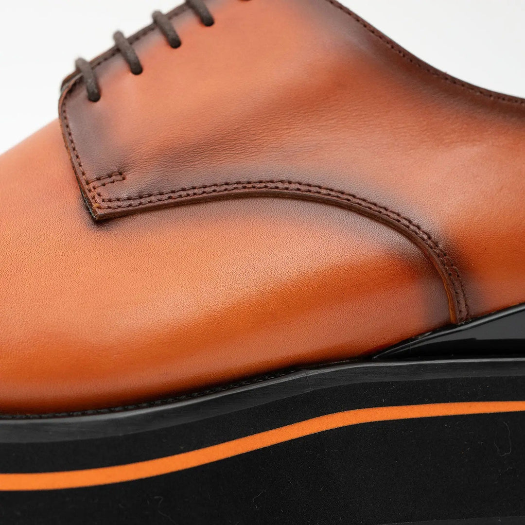 Calf leather dress three quarters derby shoes Brown close-up view highlighting handcrafted leather and stylish stitching.