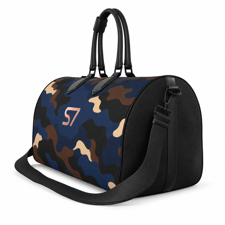 S7 Midnight Terrain leather duffle bag with midnight-blue, navy, beige, brown and black camouflage, a centered rose-gold S7 monogram and black trim.