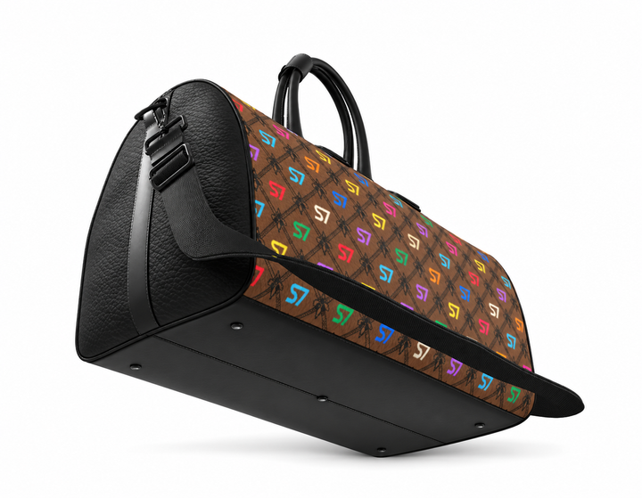 S7 Café Chromatique duffle bag with multicolor S7 monograms, coffee-brown background, black ornate lattice, black side panels, and shoulder strap.