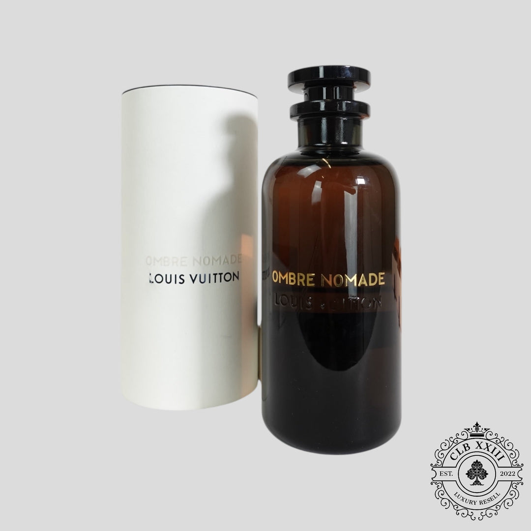 Louis Vuitton Ombre Nomade perfume bottle and packaging on a light gray background