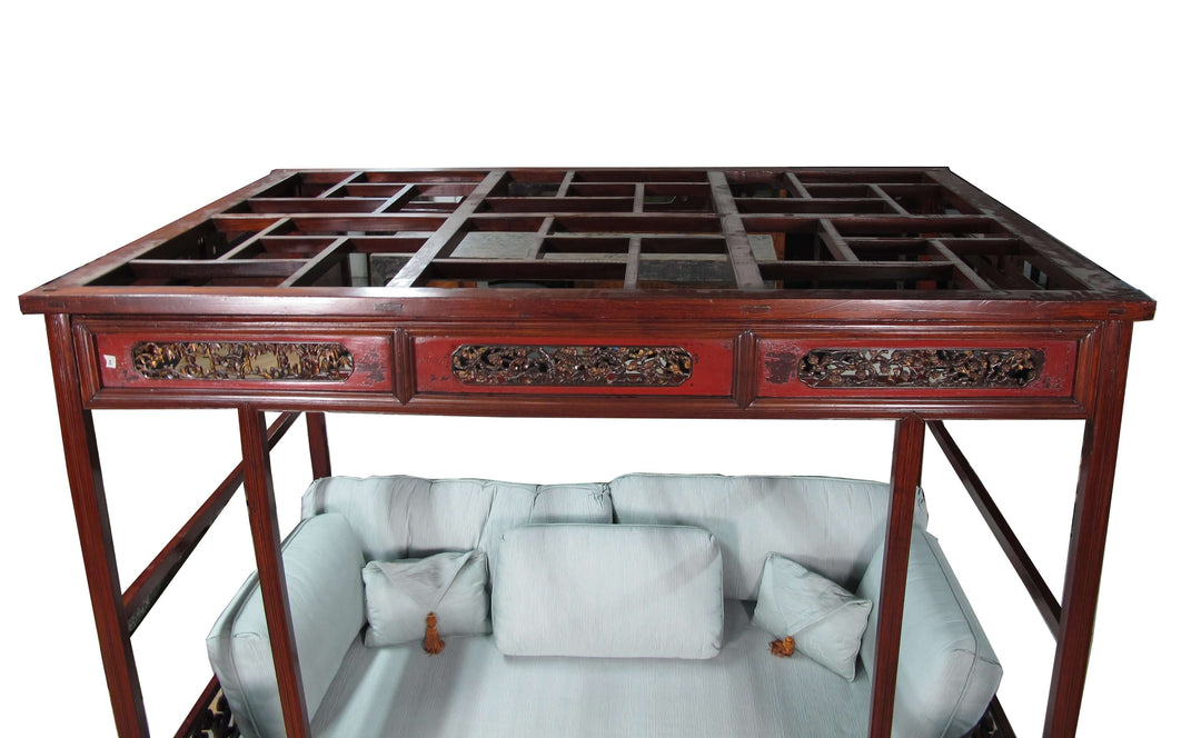 Traditional wooden table with intricate carvings on a white background