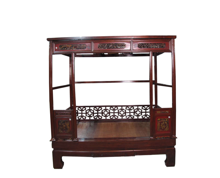 Wooden display cabinet with intricate carvings on a white background