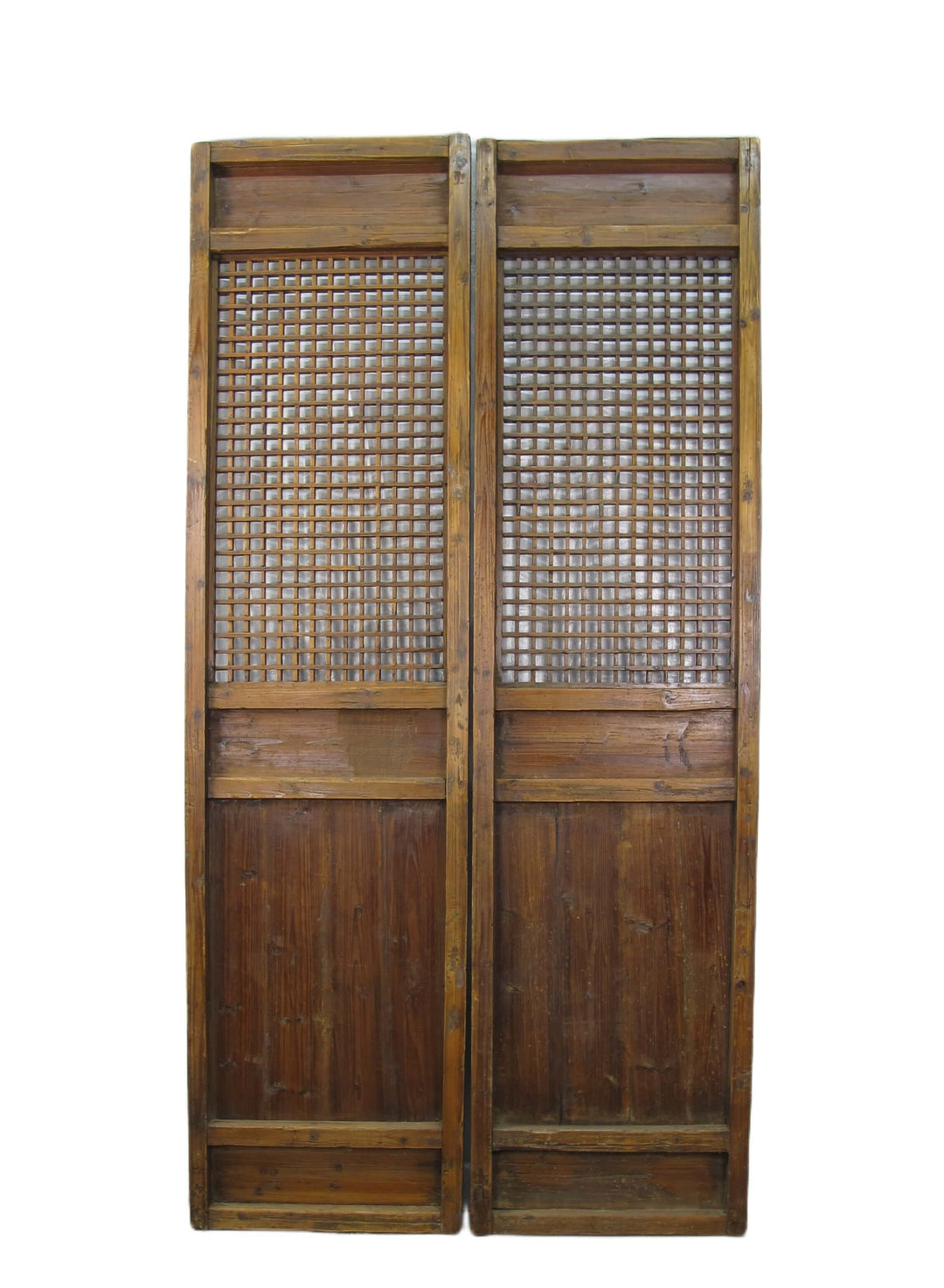 Pair of wooden doors with lattice design on a white background