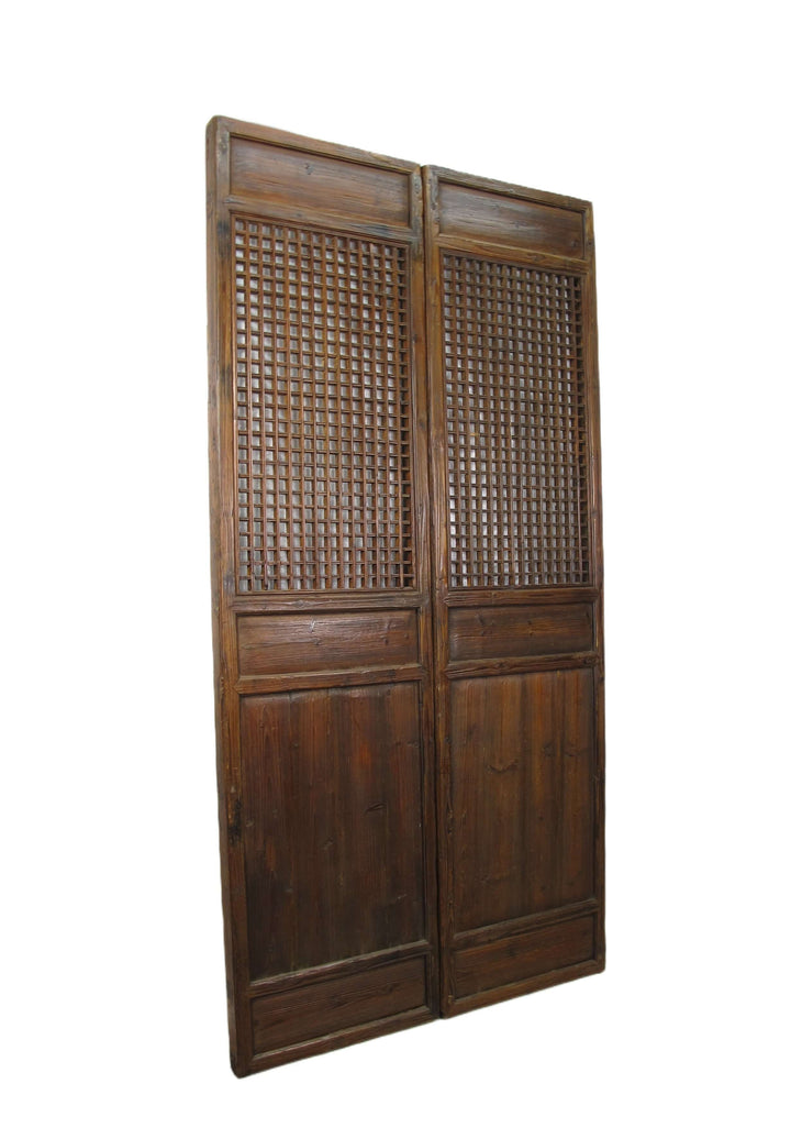 Wooden screen with lattice design on a white background