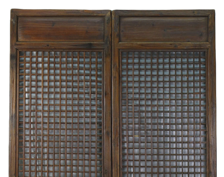 Pair of wooden latticed doors on a white background