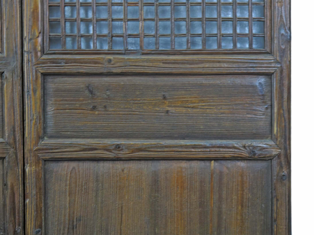 Close-up of a wooden door with a grid pattern