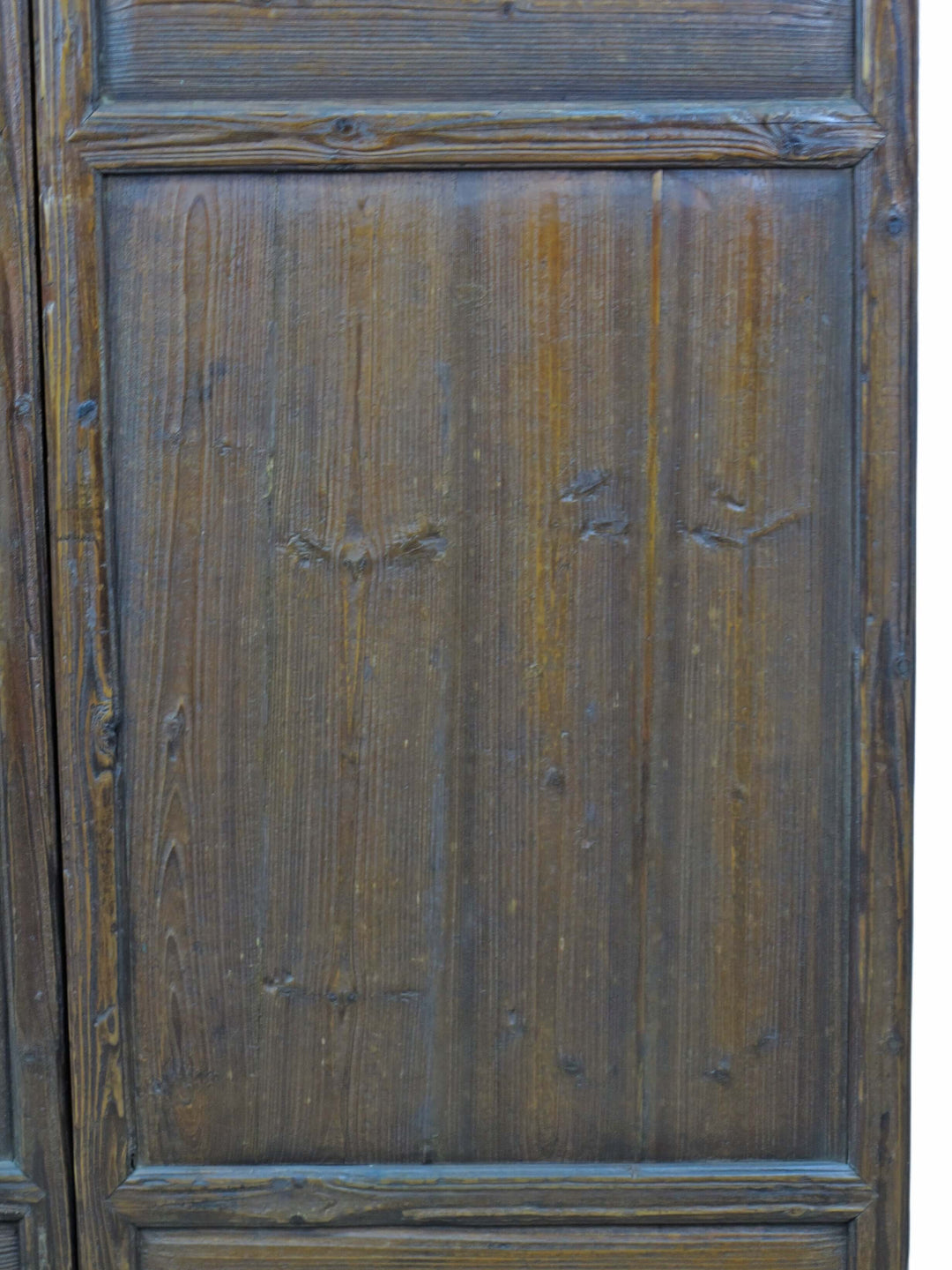 Close-up of a wooden panel with visible grain and texture