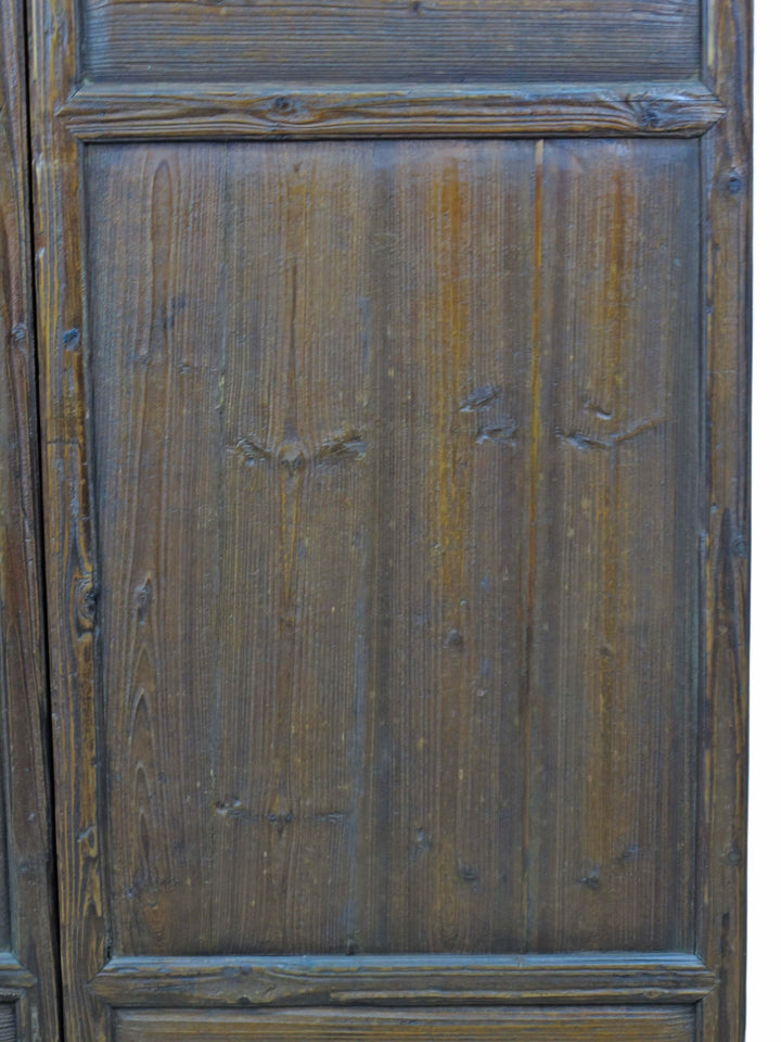 Close-up of a wooden panel with visible grain and texture