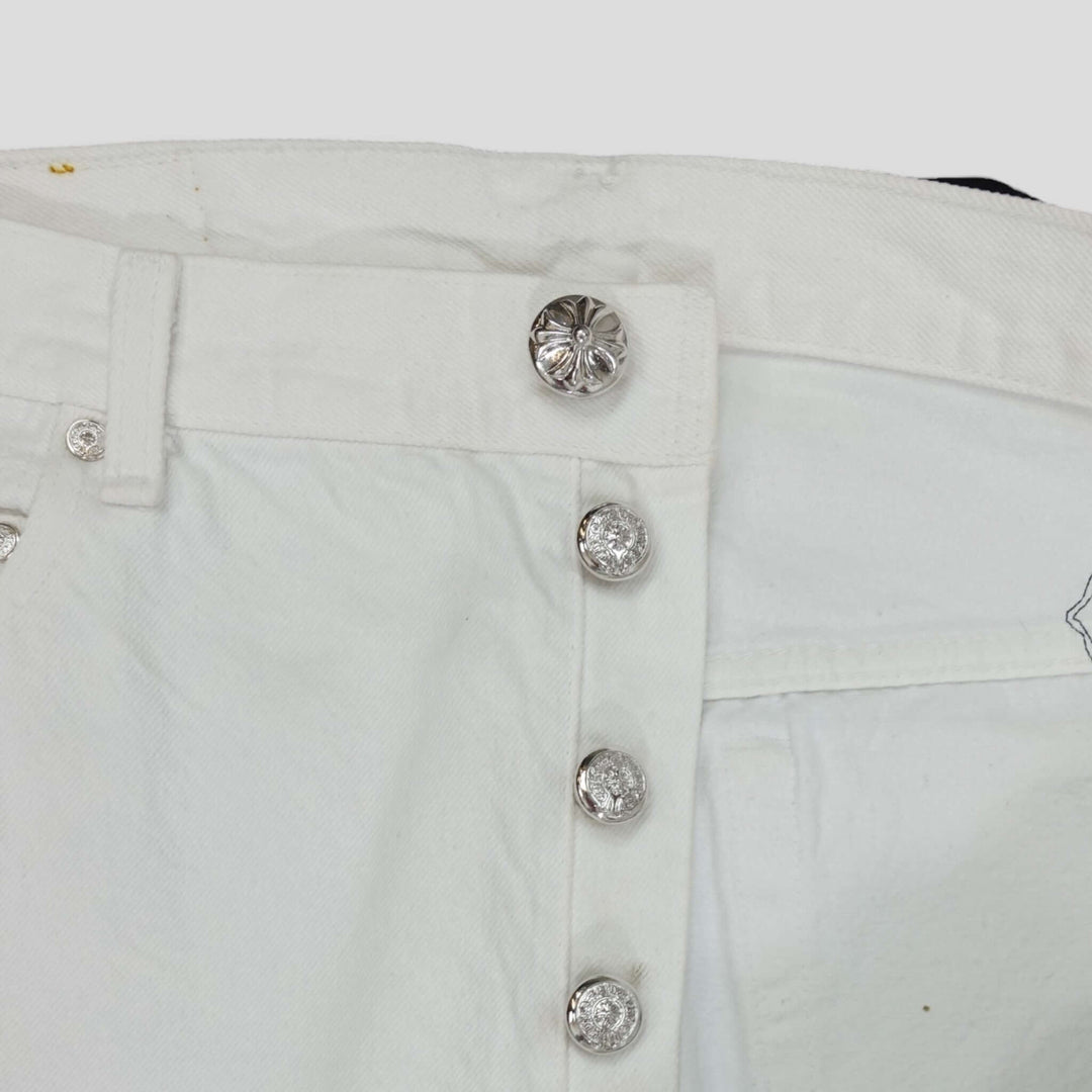 Close-up of Chrome Hearts Levis Cross Patch Jeans in White / Leopard showcasing .925 sterling silver hardware.