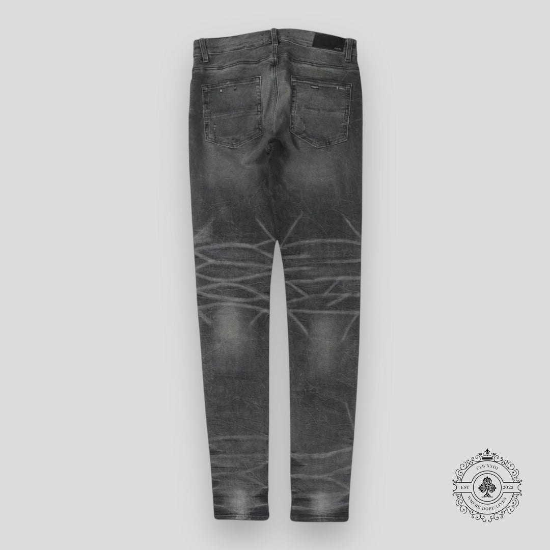 Amiri Faded Denim Jeans in Grey