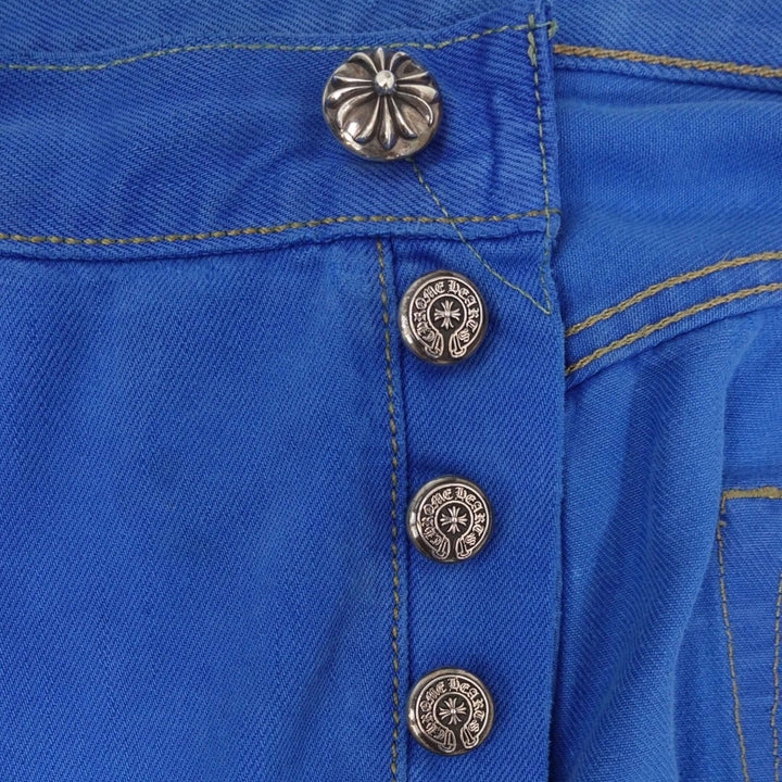 Close-up of Chrome Hearts Levis Cross Patch Jeans in Blue showcasing unique button details and authentic luxury denim craftsmanship.
