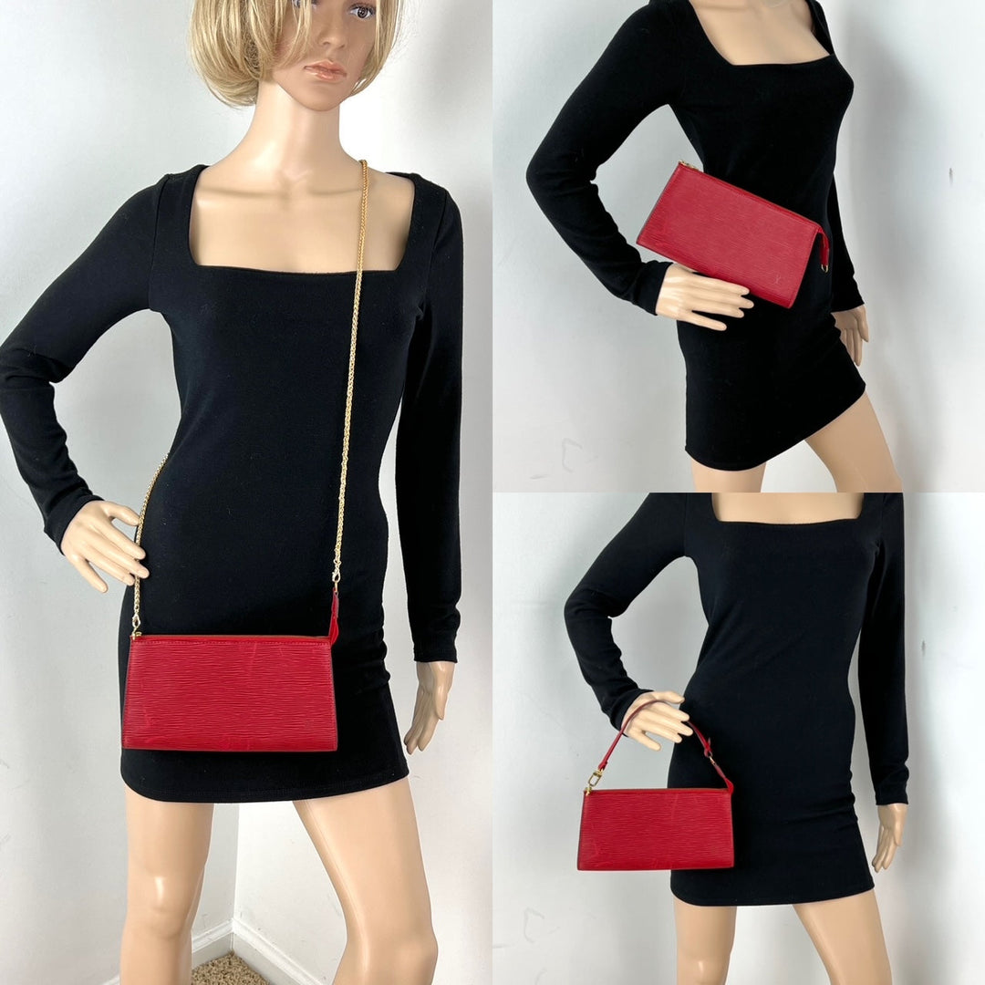 Black dress with red accents worn by mannequins against a white background