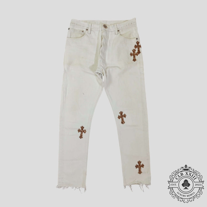 Chrome Hearts Leopard Cross Patch Jeans in White with cross patches and distressed hem, luxury denim by Chrome Heart.