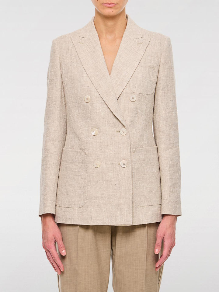 Beige blazer worn by a person on a white background