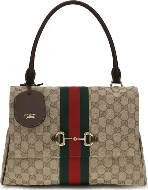 Gucci GG Supreme canvas handbag with a green and red web stripe, gold-tone horsebit hardware, and dark brown leather handles on a white background.