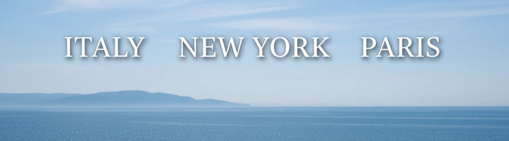 Ocean view with 'ITALY', 'NEW YORK', and 'PARIS' text overlay