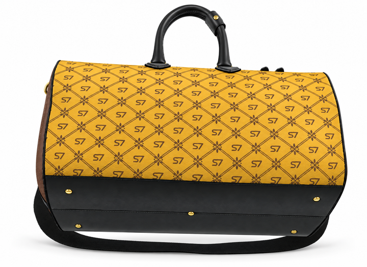 A yellow and black duffel bag with a repeating &