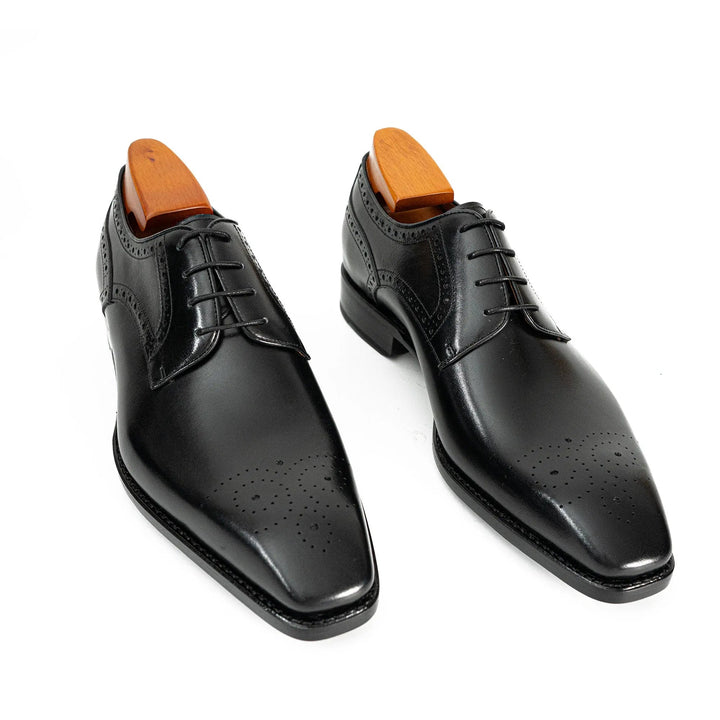Goodyear Welted Patent Leather Oxford Shoes by DV DIVINCH in sleek black, featuring brogue detailing and pointed toe.