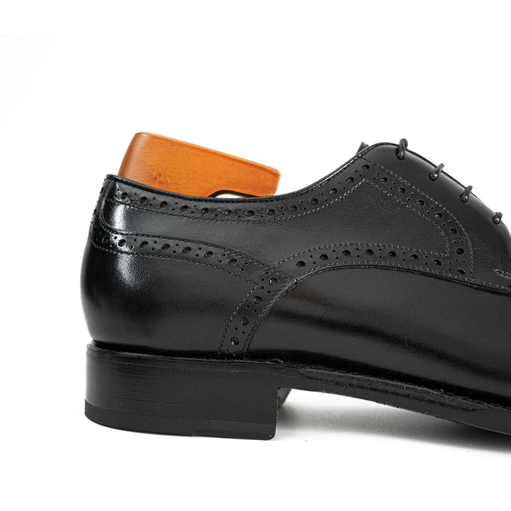 Goodyear Welted Patent Leather Oxford Shoes side view in black calfskin with brogue detailing, handmade craftsmanship by DV DIVINCH.