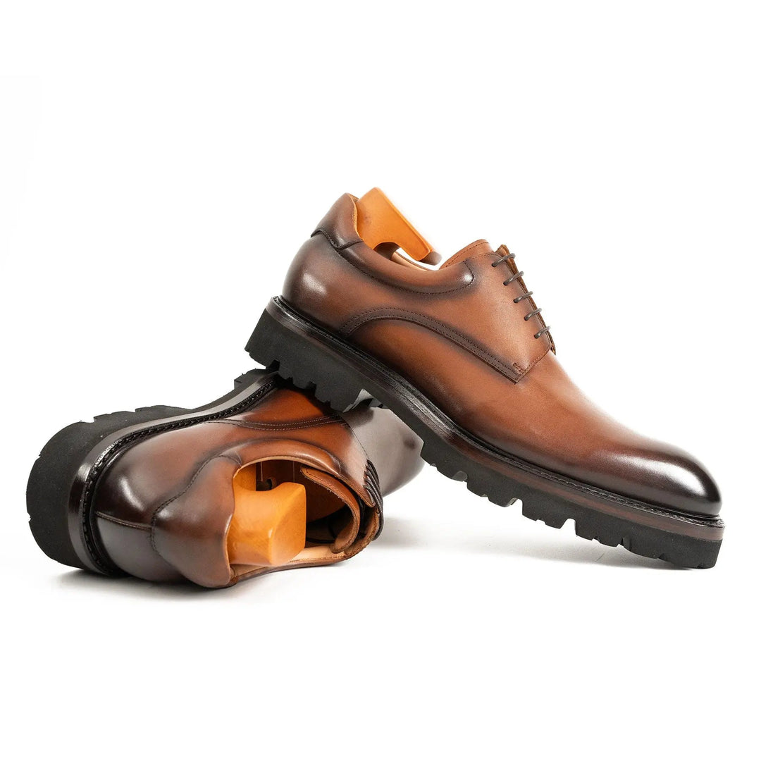 Handmade Goodyear Welted Derby Shoes by DV DIVINCH in brown polished calfskin with lug sole, showcasing front and side view.