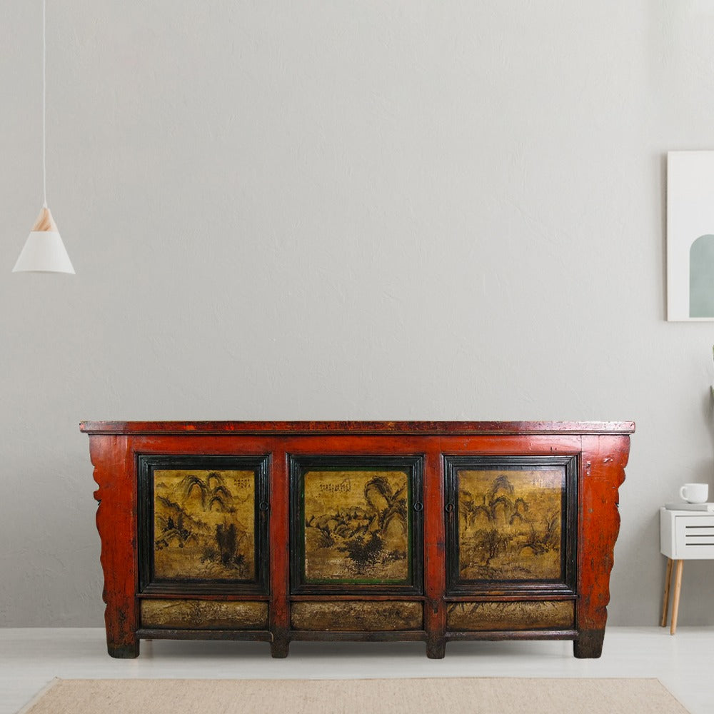 Vintage wooden sideboard with painted panels in a modern room