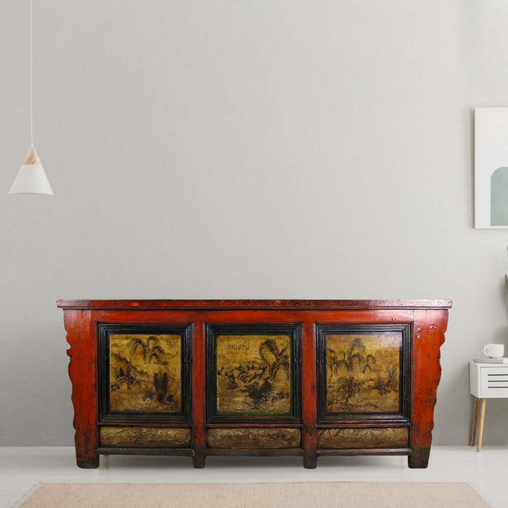 Vintage wooden sideboard with painted panels in a modern room