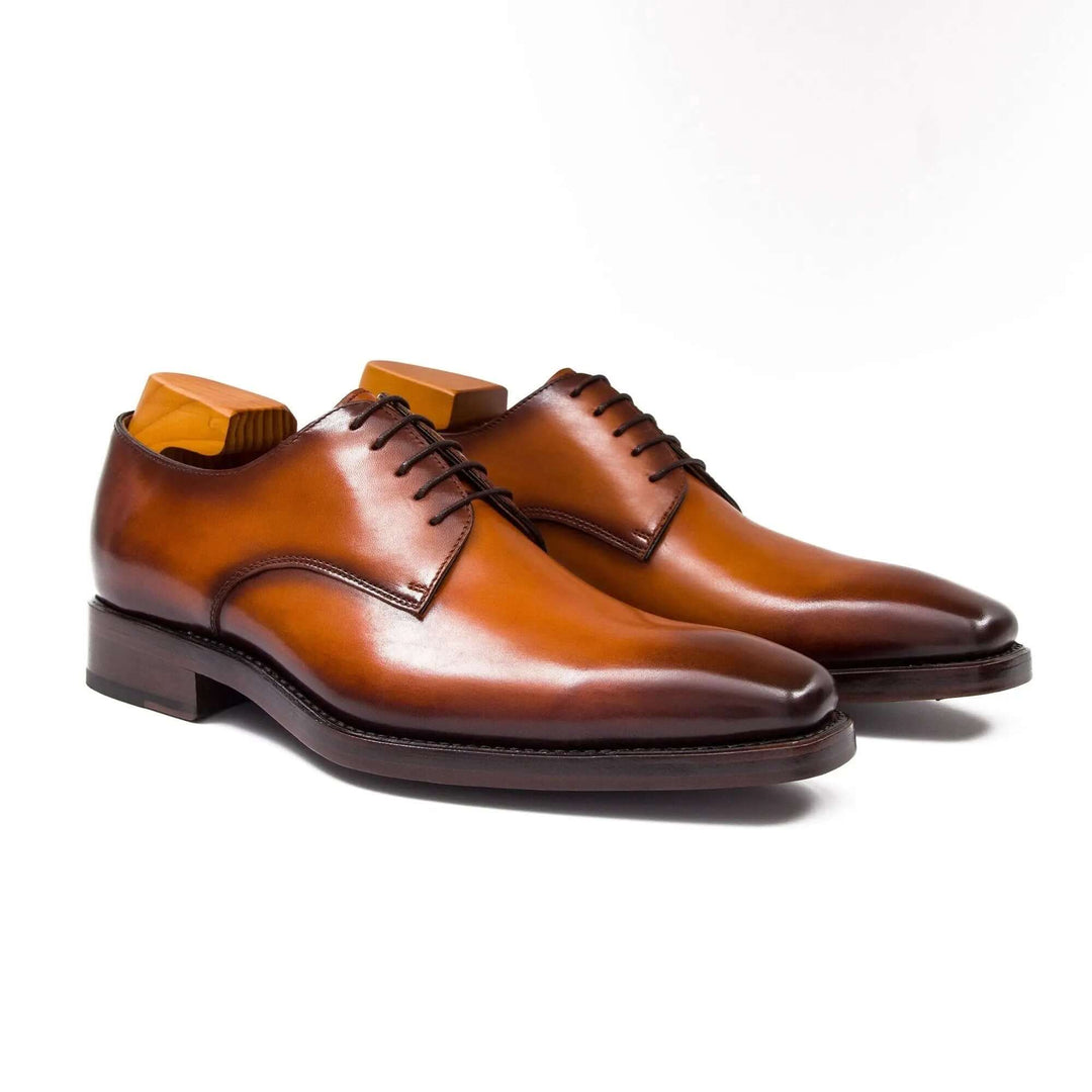 Goodyear Handmade Leather Derby Shoes in brown calfskin with sleek design and lace-up detail.
