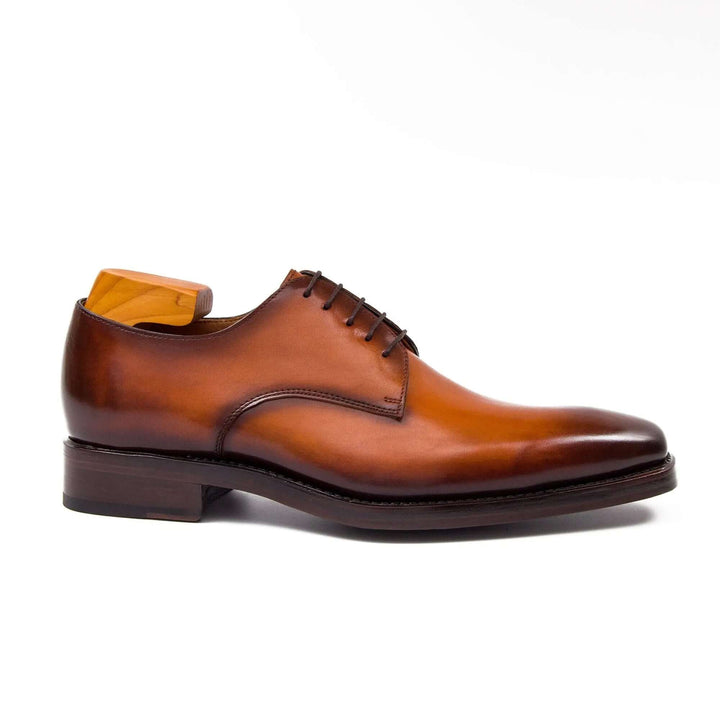 Goodyear Handmade Leather Derby Shoes in brown calfskin featuring a sleek front view with lace-up design.