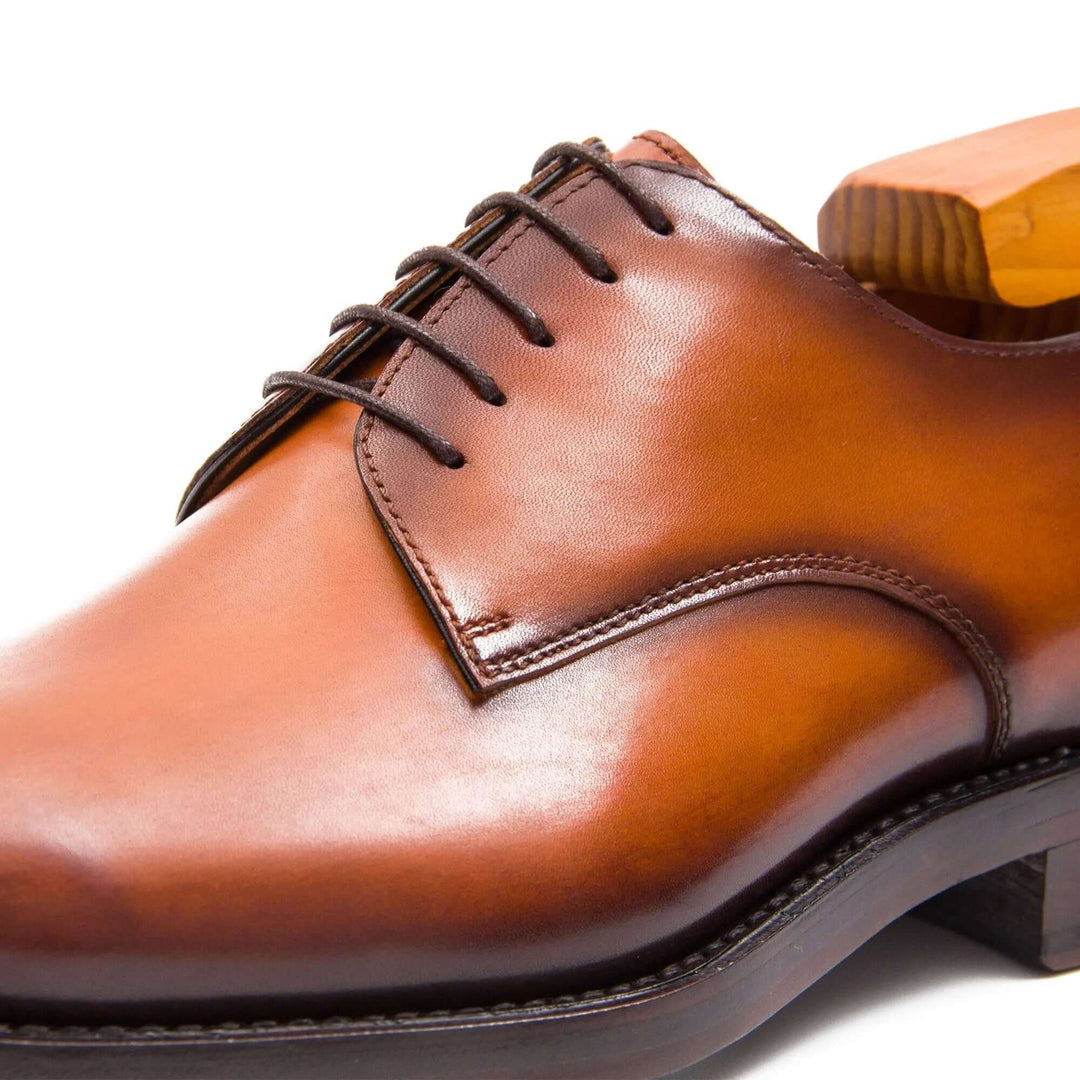 Goodyear Handmade Leather Derby Shoes in rich brown calfskin, featuring detailed lace-up design and smooth finish.