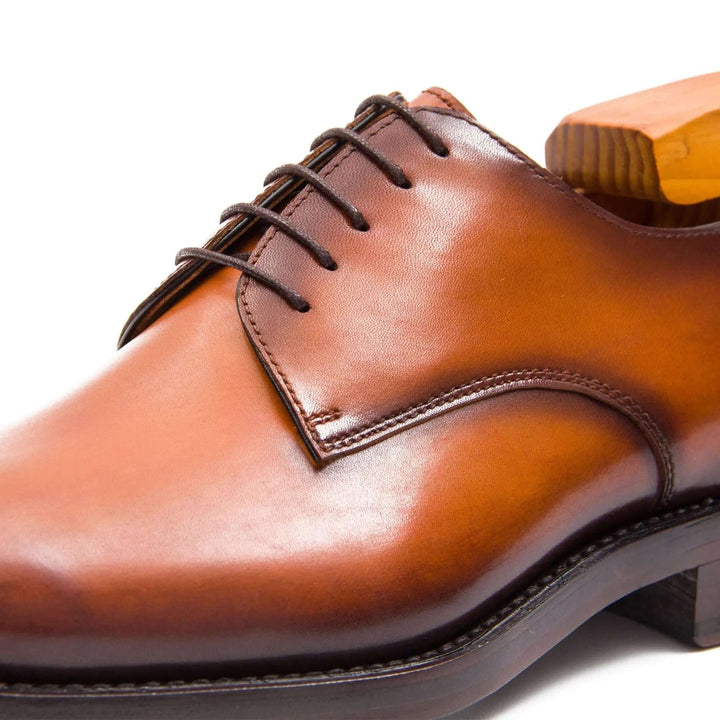Goodyear Handmade Leather Derby Shoes in rich brown calfskin, featuring detailed lace-up design and smooth finish.
